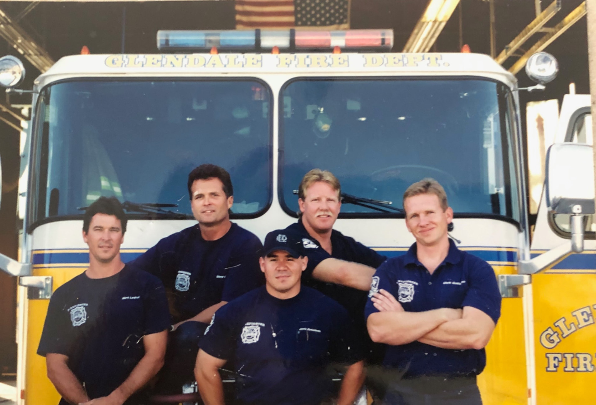 Glendale firefighters posed together in front of an engine at the station